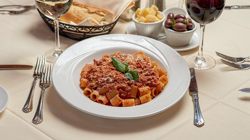 Table Setting Featuring  Rigatoni Bolognaise